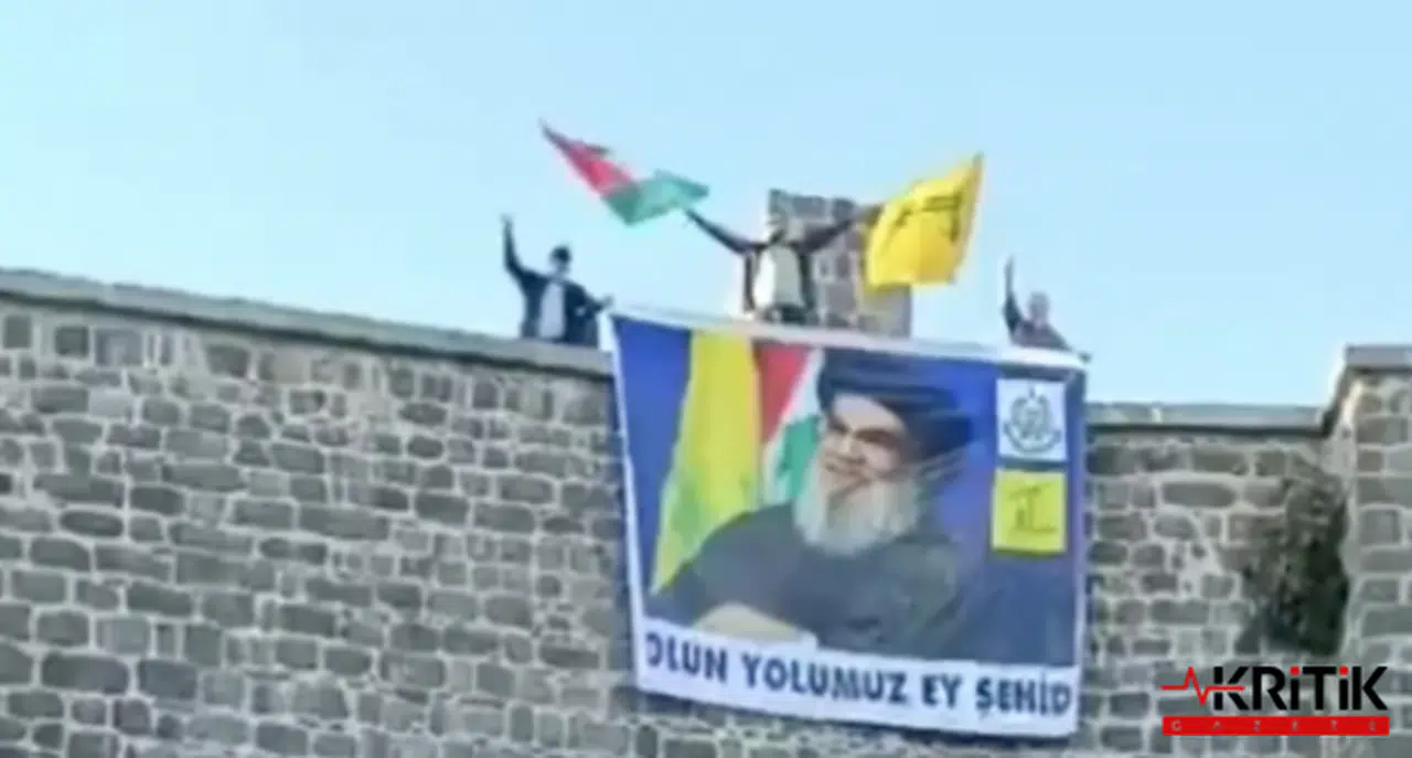 Surların üzerine Hizbullah lideri Nasrullah'ın posteri asıldı